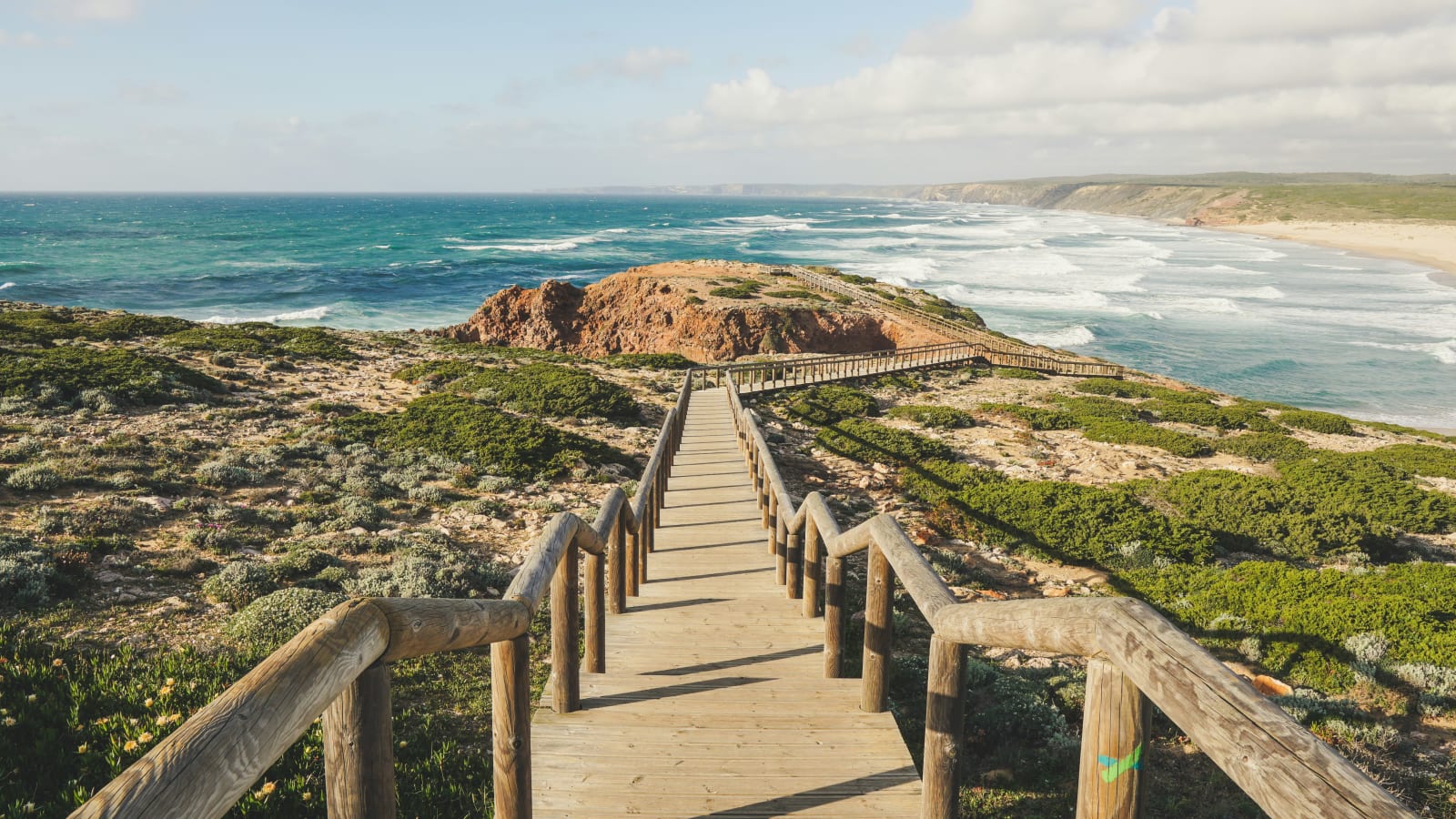 Wooden boardwalk down to an Atlantic beach in the Algarve